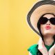 Young woman with a hat and sunglasses